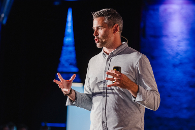Speaker presenting on the UXDX main stage