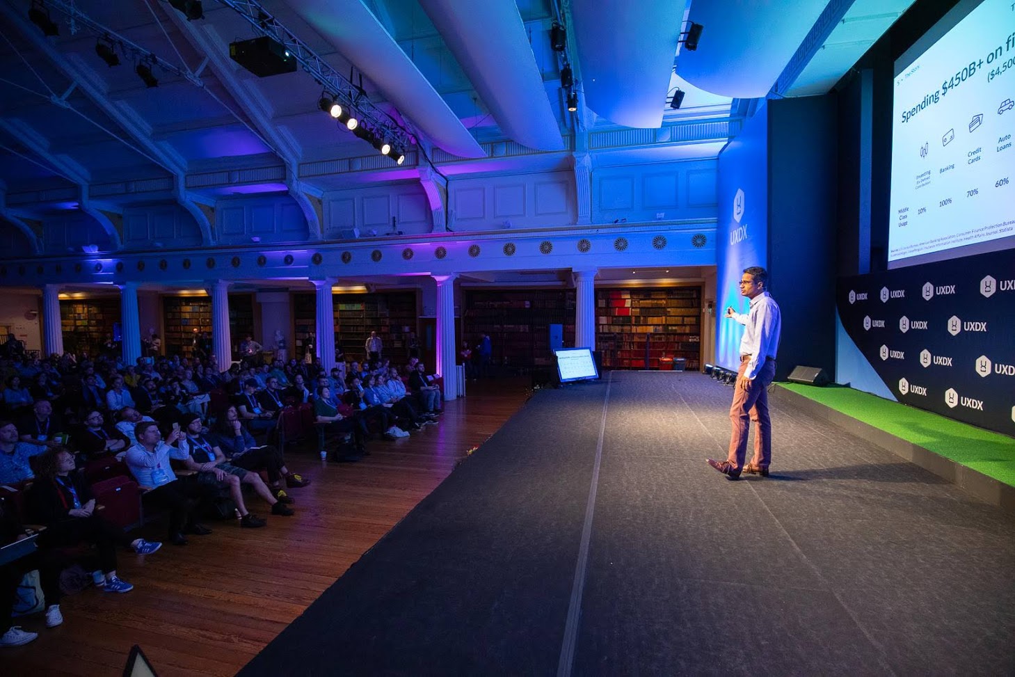 A UXDX speaker presenting on stage