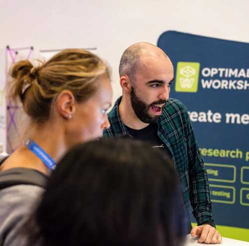 People talking at an exhibition stand